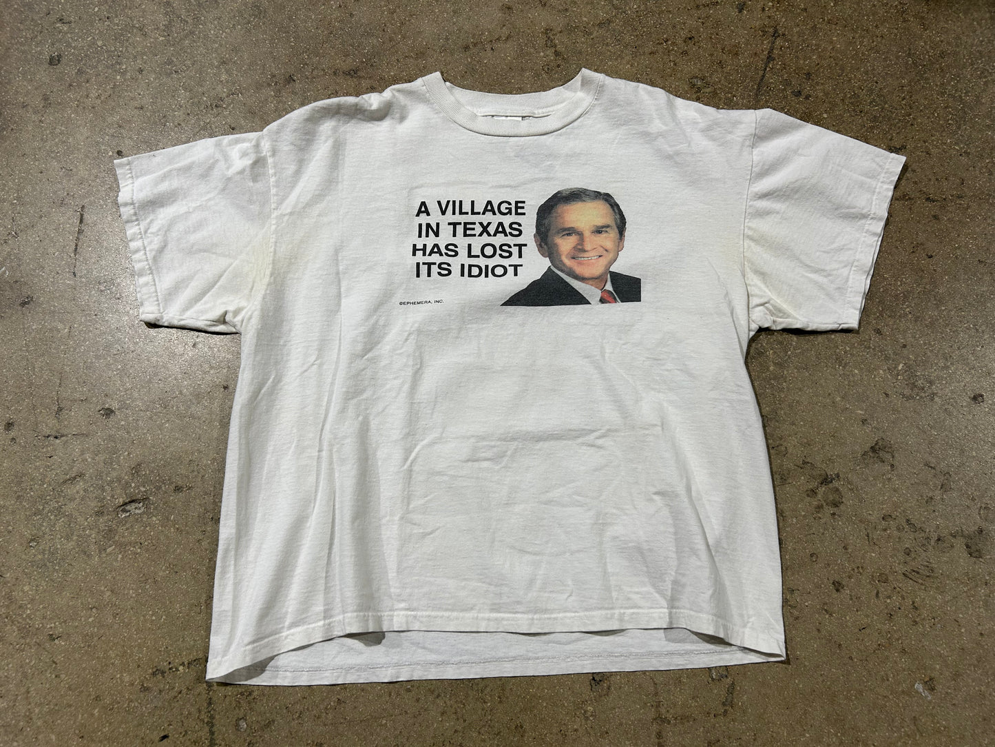 A Village In Texas Has Lost Its Idiot George Bush Tee - White Size XL